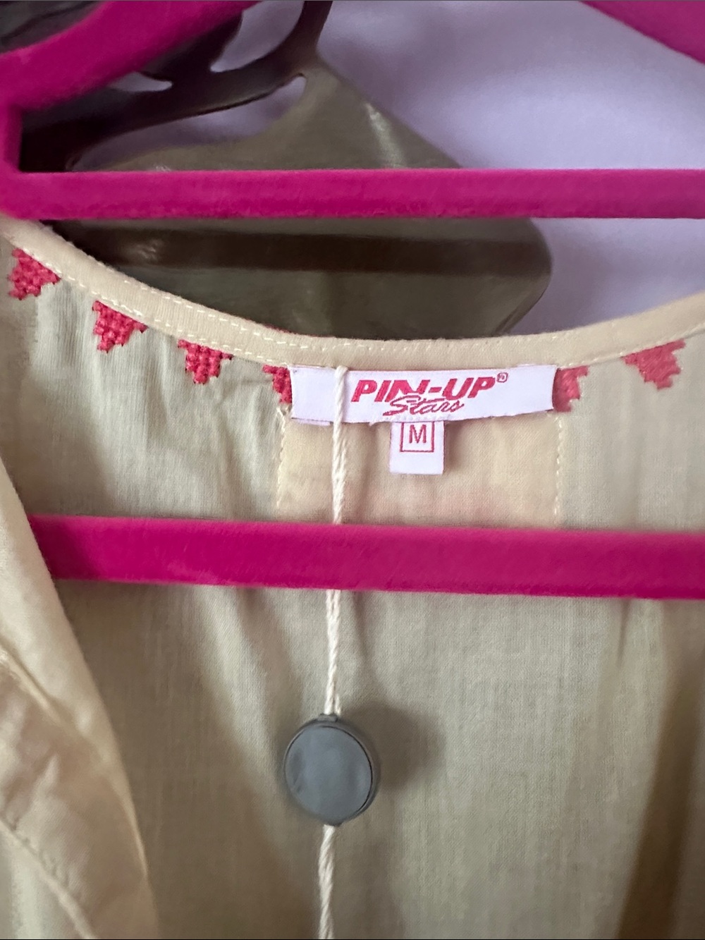 Pin-Up Stars Cream Peplum Blouse with Pink Embroidery and Tassel Ties - Picture 2 of 6